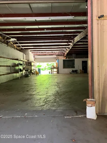 a room with water heater and racks