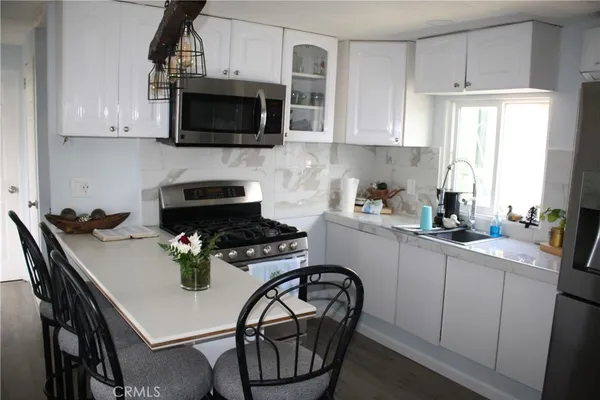 a front view of a house with sink and mirror