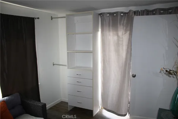 a bathroom with a sink a toilet a mirror and shower