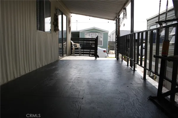 a kitchen with a refrigerator and a sink