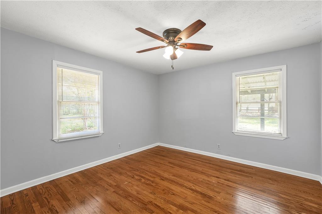 626 Grayson Parkway Grayson, GA 30017 - Photo 20 of 27 a view of an empty room with wooden floor and a window
