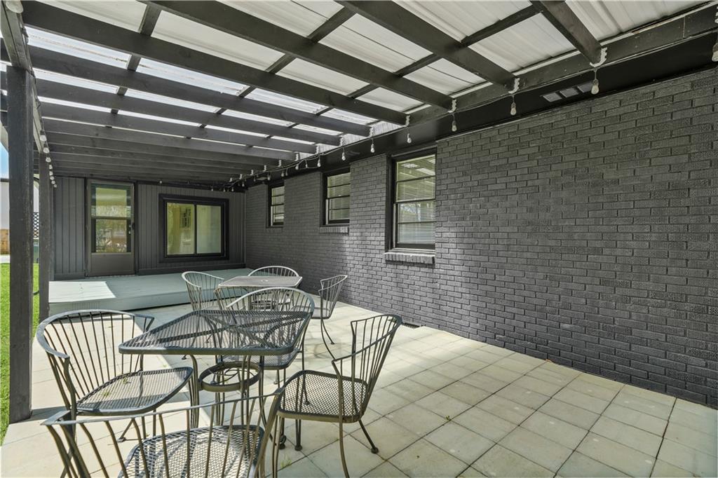 626 Grayson Parkway Grayson, GA 30017 - Photo 26 of 27 a backyard of a house with table and chairs