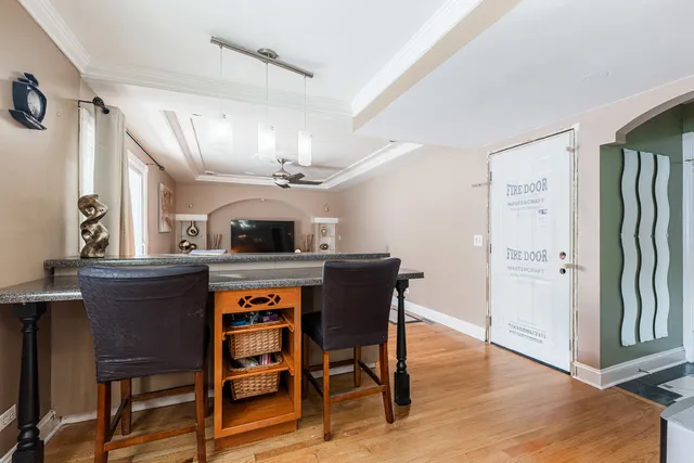 a view of a dining room with furniture and wooden floor