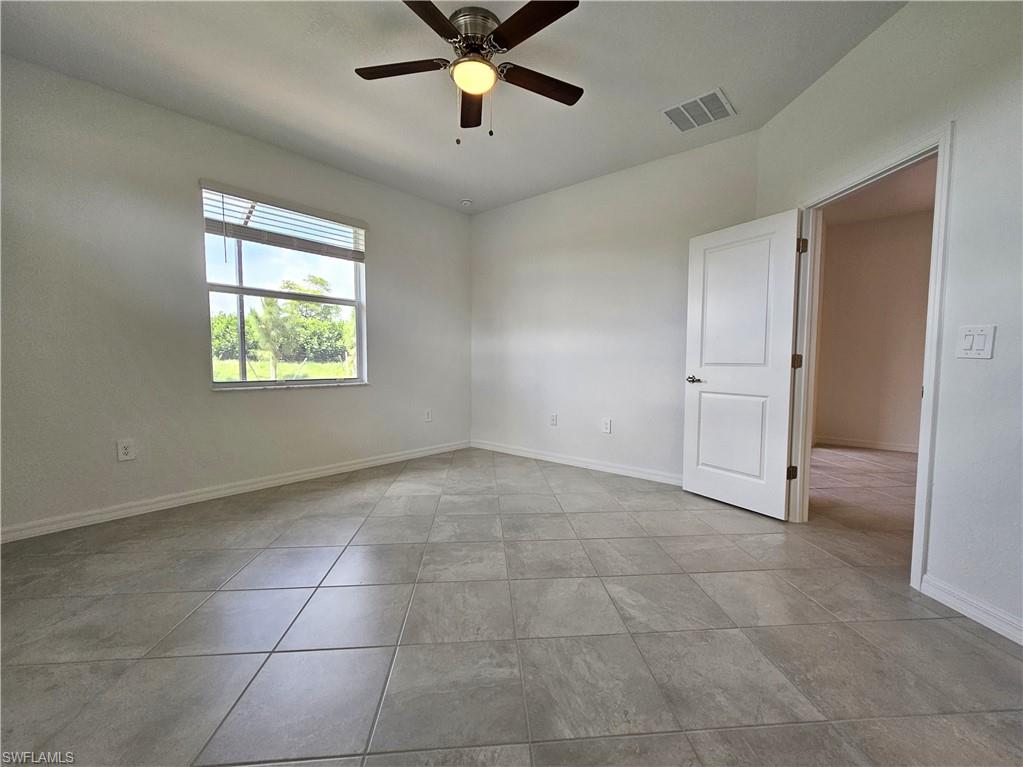 2168 Dragonfruit Way Naples, FL 34120 - Photo 12 of 27 a view of an empty room with a window