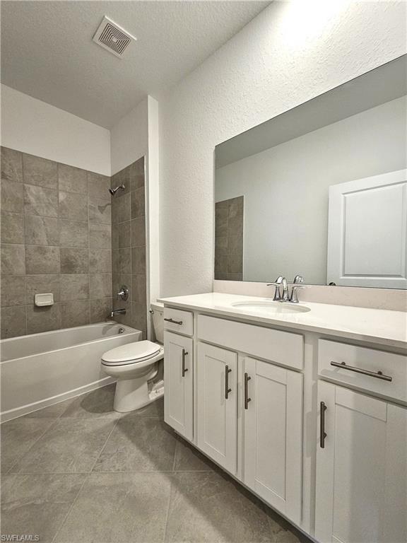 2168 Dragonfruit Way Naples, FL 34120 - Photo 18 of 27 a bathroom with a double vanity sink toilet and bathtub