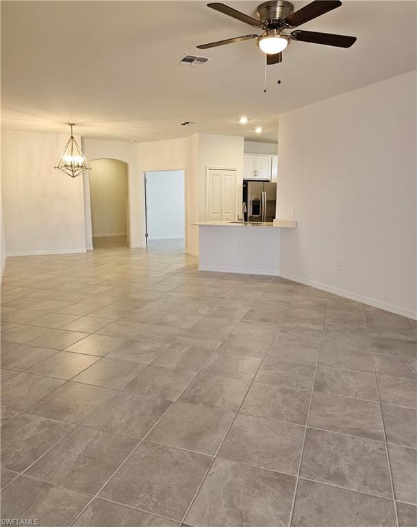 2168 Dragonfruit Way Naples, FL 34120 - Photo 6 of 27 a view of a livingroom with a kitchen
