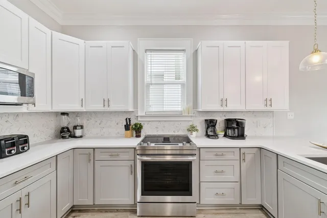 a living room with furniture a window and a dining table