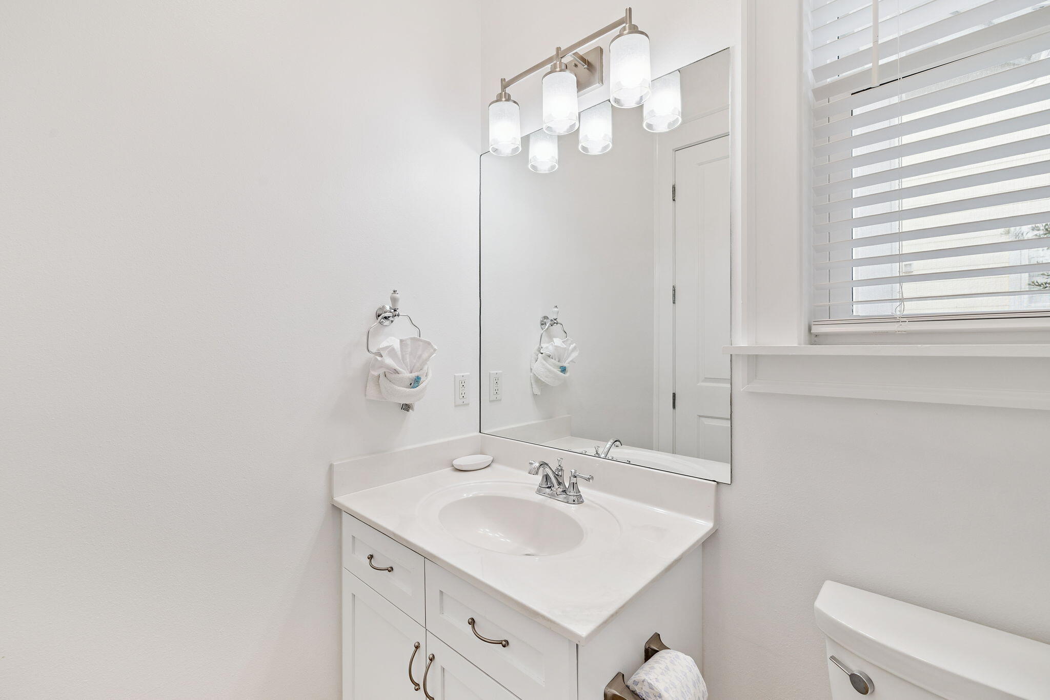 8 Barefoot Lane Seacrest, FL 32461 - Photo 25 of 62 a bathroom with a sink vanity mirror and toilet