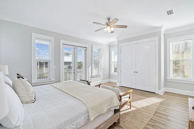 a bedroom with a flat screen tv and a bed