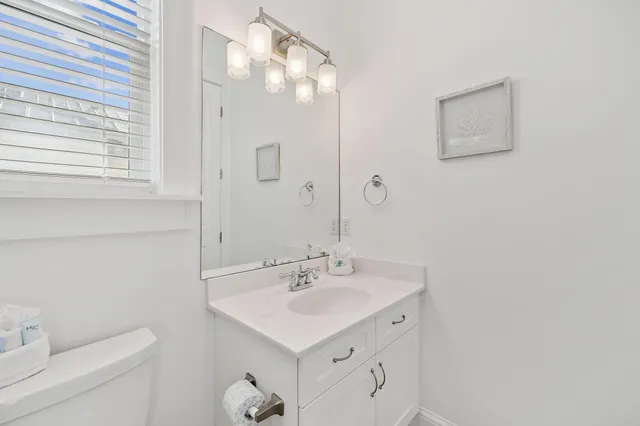 a view of a chair and table in the balcony