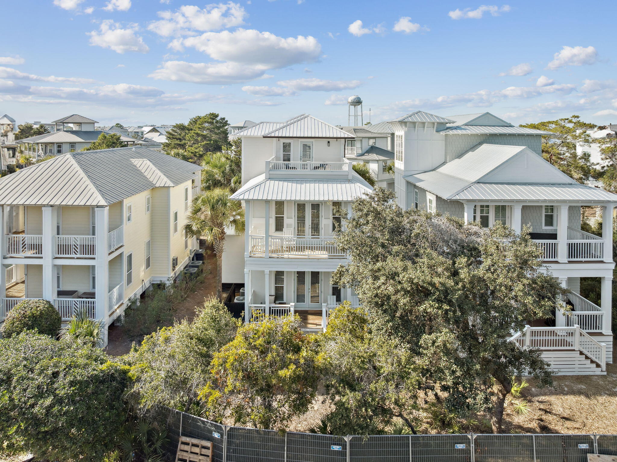 8 Barefoot Lane Seacrest, FL 32461 - Photo 42 of 62 a front view of a residential apartment building with a yard