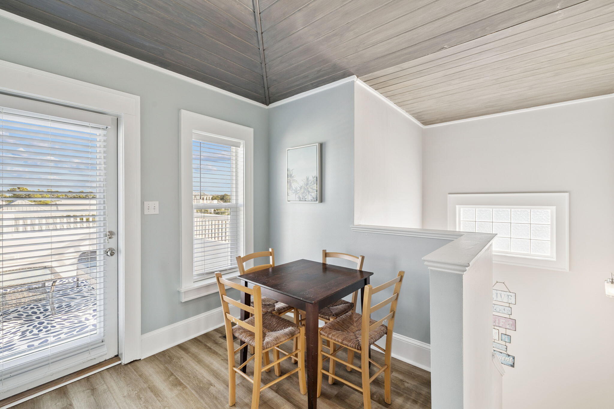 8 Barefoot Lane Seacrest, FL 32461 - Photo 44 of 62 a view of a dining room with furniture and wooden floor