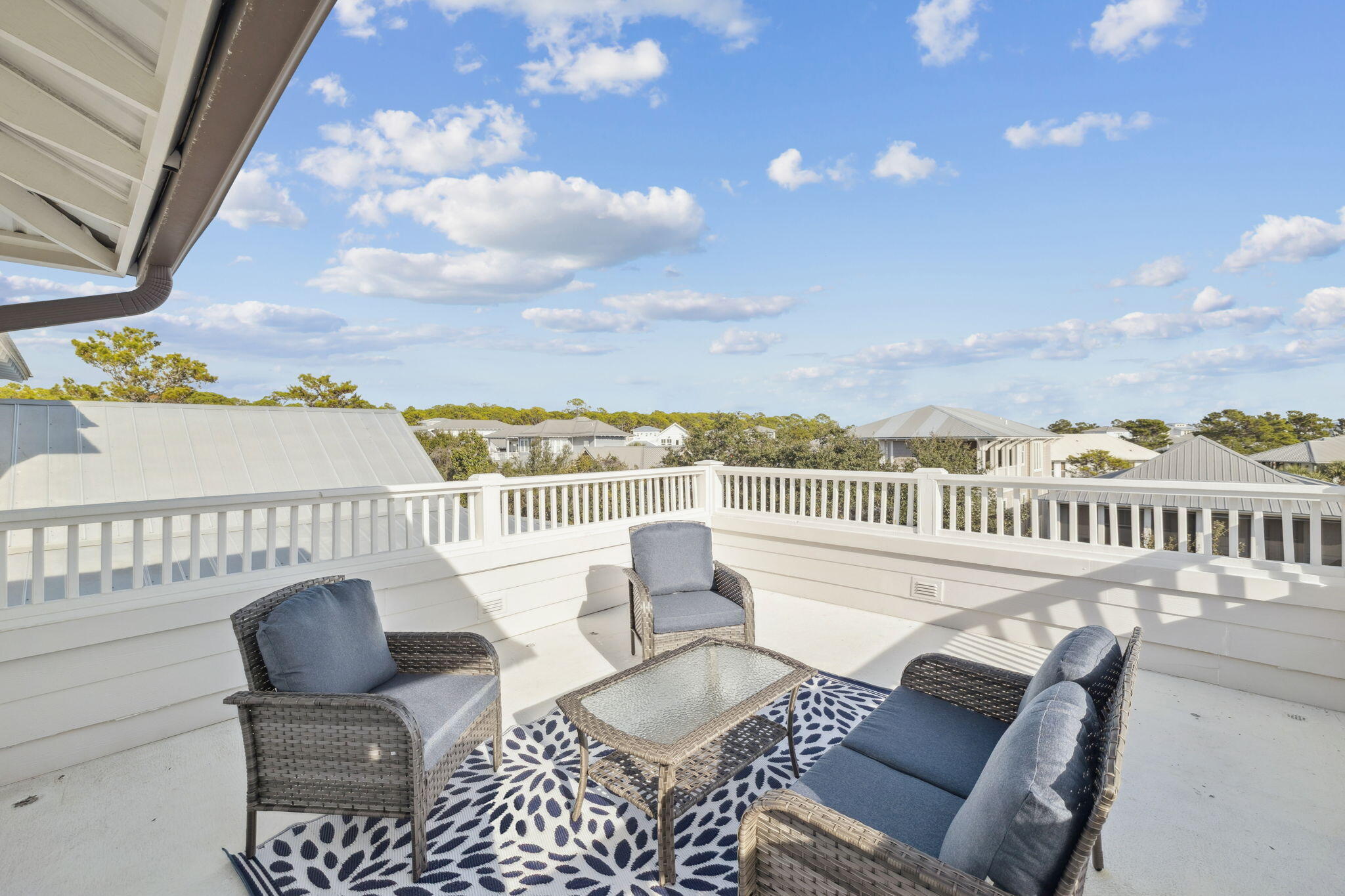 8 Barefoot Lane Seacrest, FL 32461 - Photo 47 of 62 a view of a chair and table in the balcony