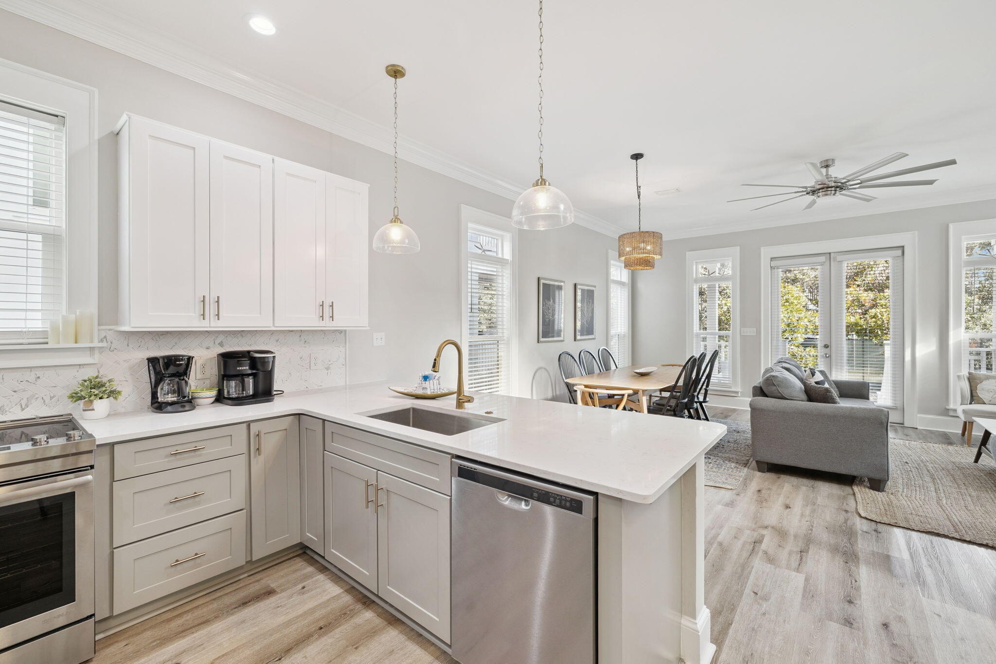 8 Barefoot Lane Seacrest, FL 32461 - Photo 10 of 62 a kitchen that has a lot of white cabinets and couches