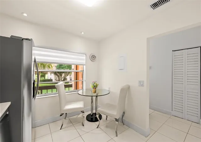 a view of a livingroom with furniture and a window
