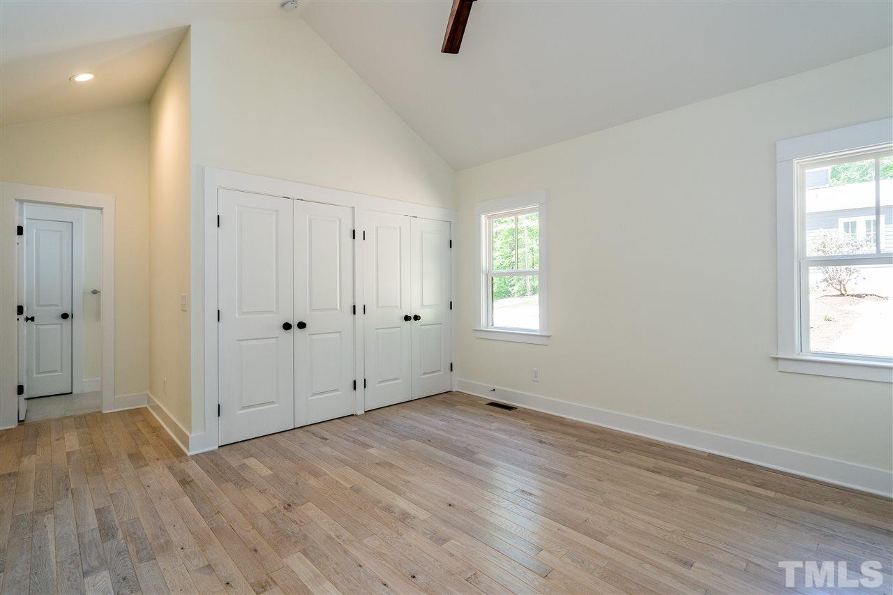1700 Evergreen Avenue Raleigh, NC 27603 - Photo 19 of 27 an empty room with wooden floor and windows