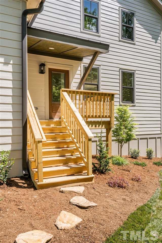 1700 Evergreen Avenue Raleigh, NC 27603 - Photo 3 of 27 a front view of a house with a yard