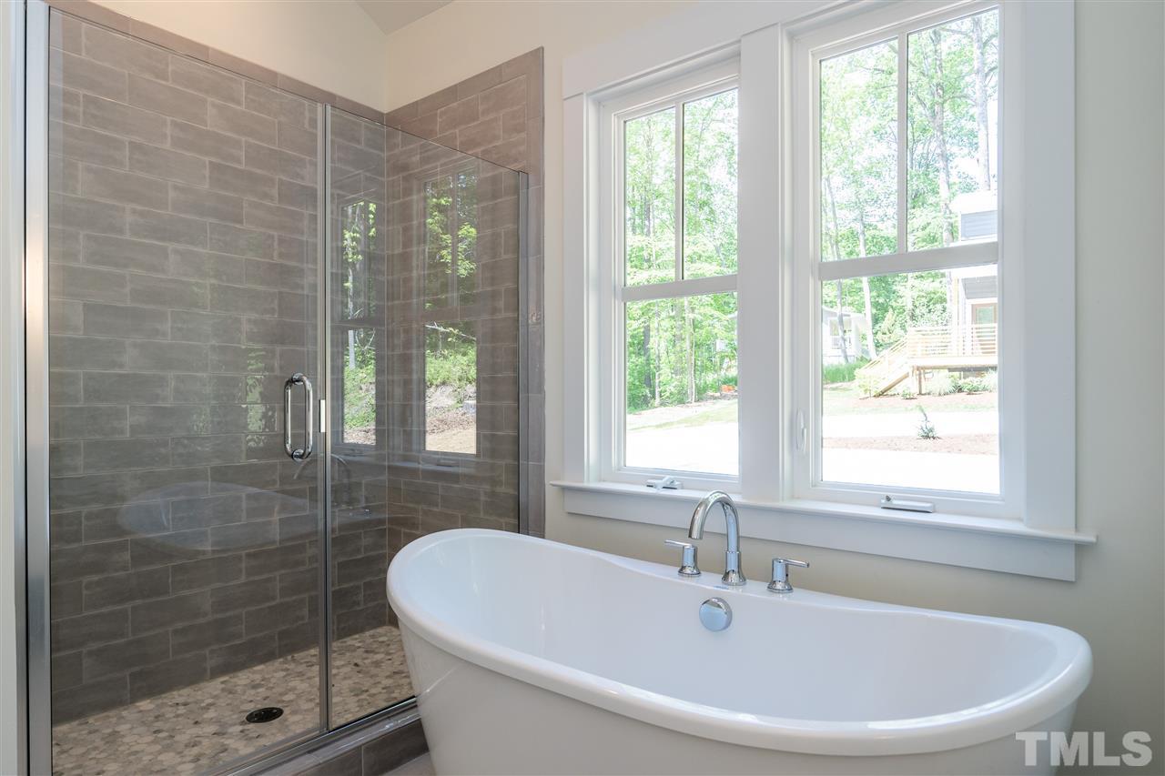 1700 Evergreen Avenue Raleigh, NC 27603 - Photo 21 of 27 a white bath tub sitting next to a window