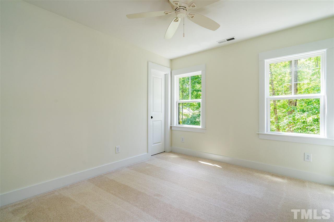 1700 Evergreen Avenue Raleigh, NC 27603 - Photo 25 of 27 an empty room with a window and a fan