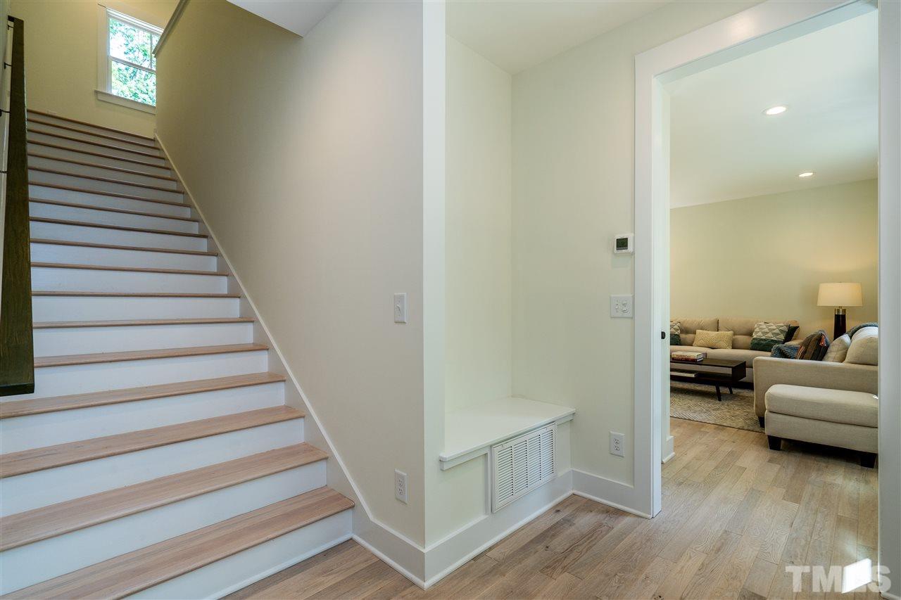 1700 Evergreen Avenue Raleigh, NC 27603 - Photo 5 of 27 a view of a livingroom with hardwood floor and staircase
