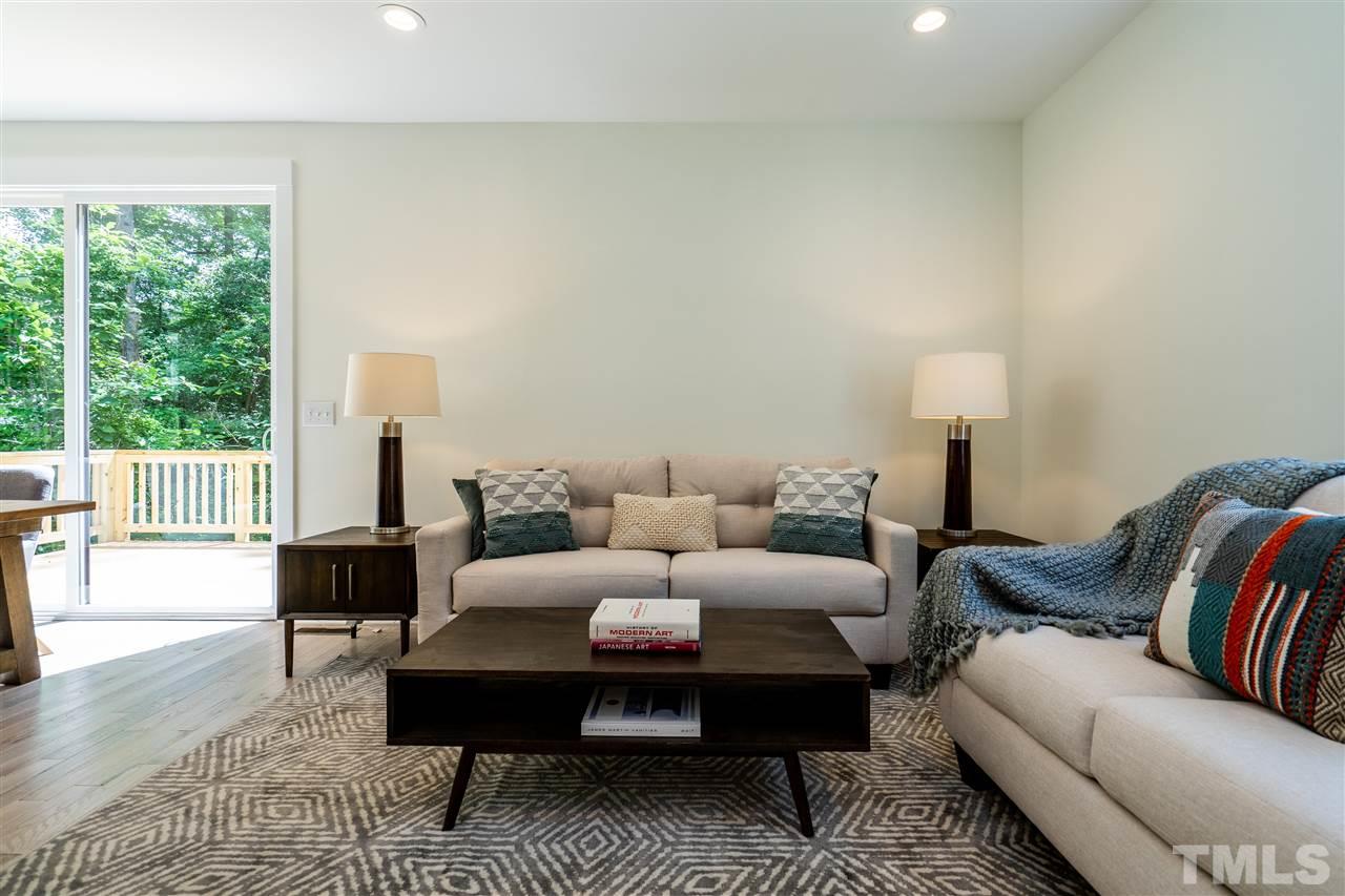 1700 Evergreen Avenue Raleigh, NC 27603 - Photo 7 of 27 a living room with furniture lamp and a table