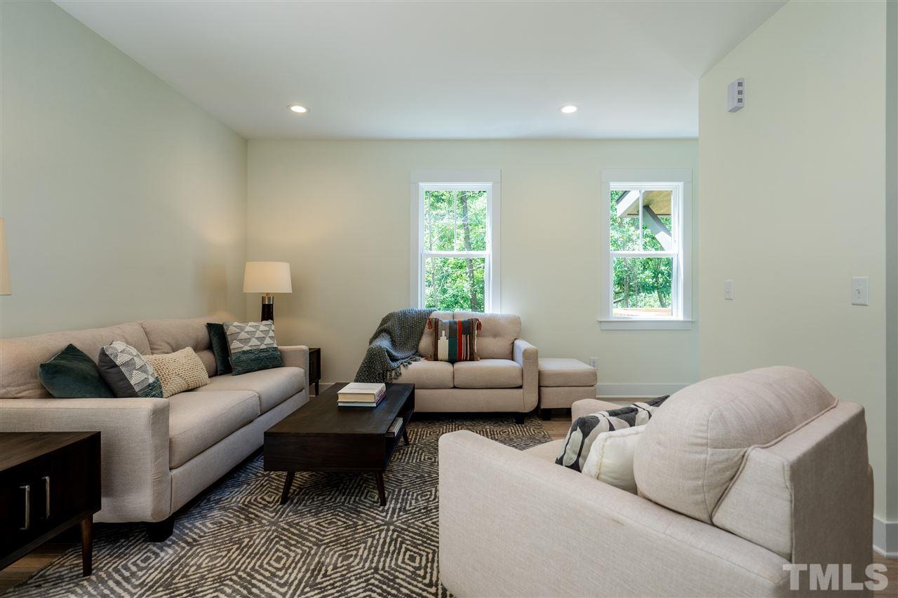 1700 Evergreen Avenue Raleigh, NC 27603 - Photo 9 of 27 a living room with furniture and a window