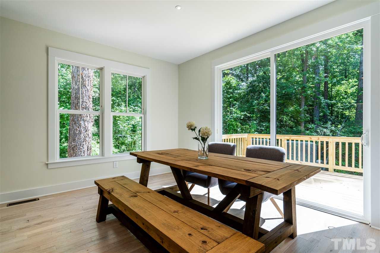 1700 Evergreen Avenue Raleigh, NC 27603 - Photo 10 of 27 a view of a dining room with furniture window and outside view