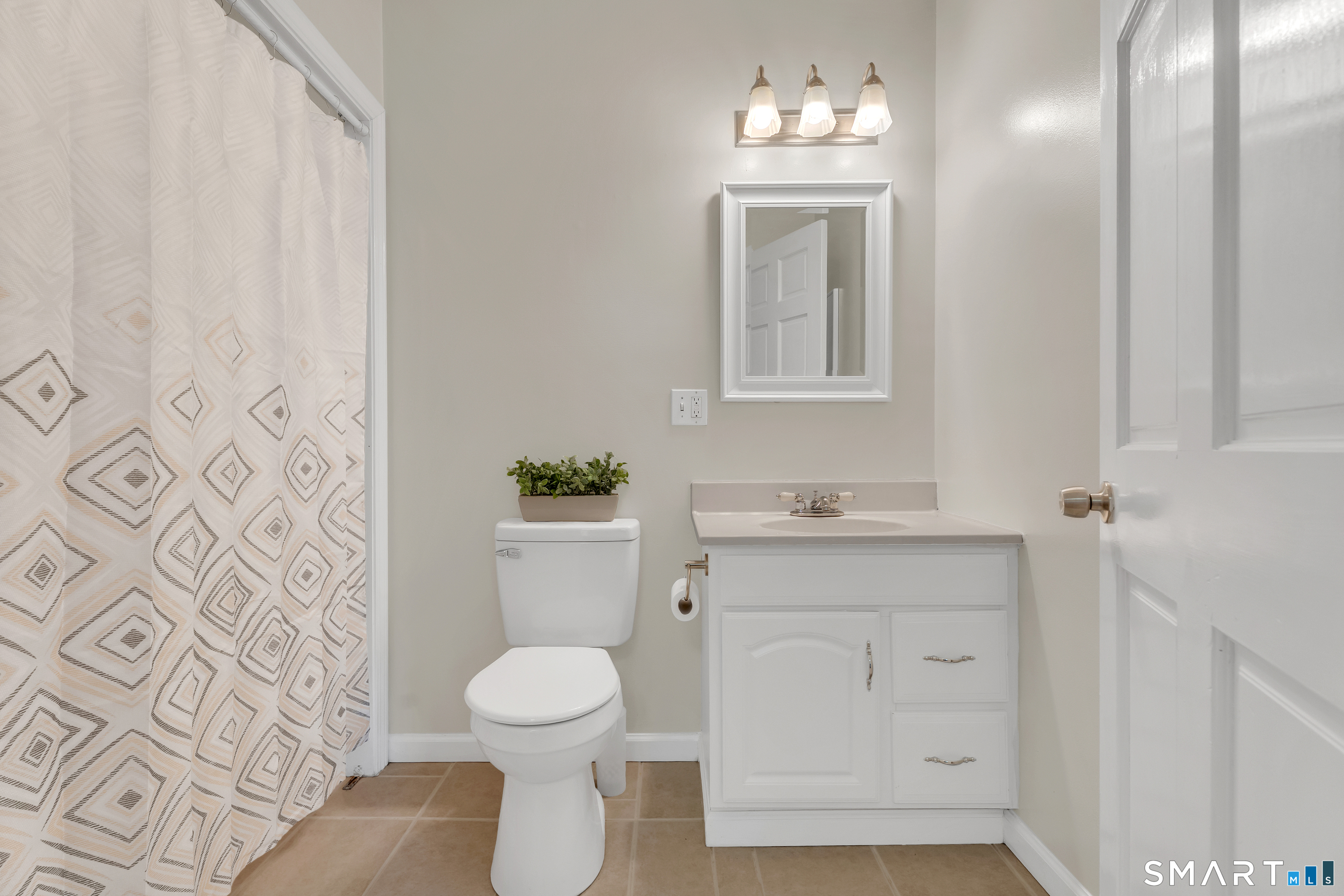 75 Summit Street Norwich, CT 06360 - Photo 25 of 40 a bathroom with a toilet sink and mirror