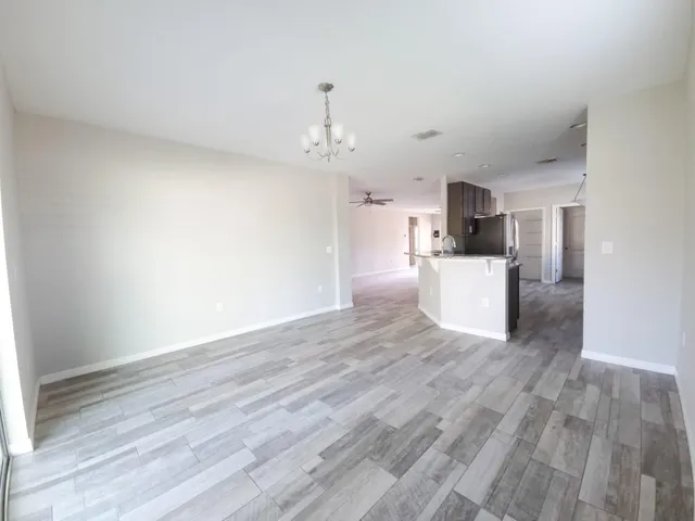 a view of a kitchen with wooden floor