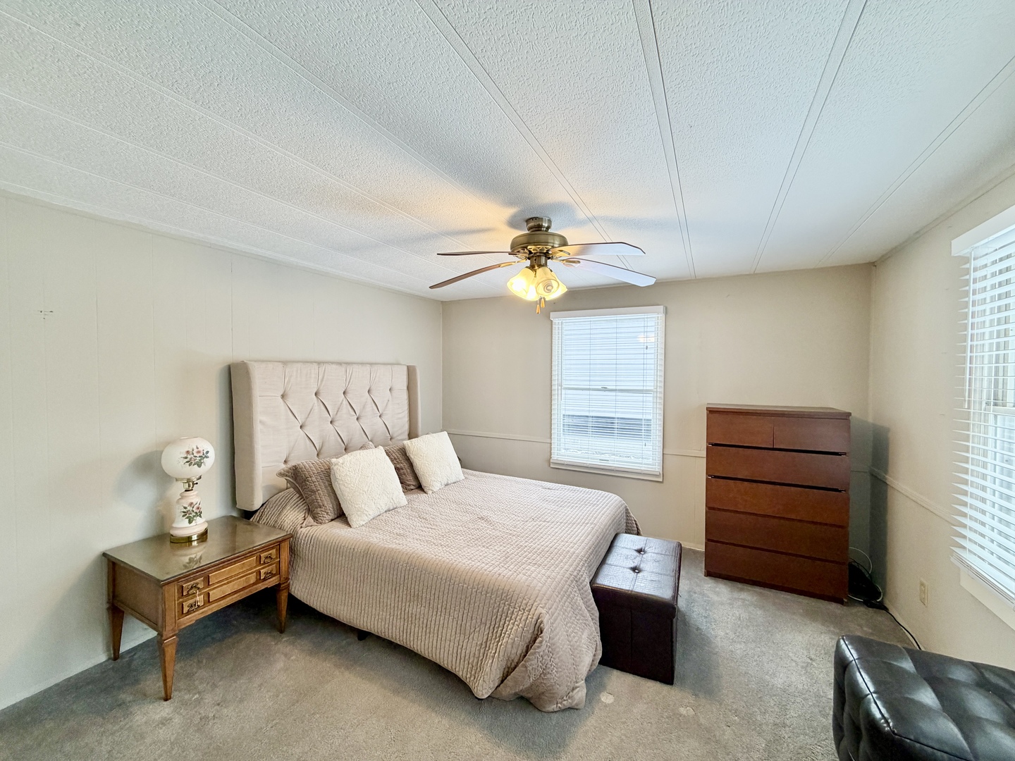 114 Melbrooke Road Elgin, IL 60123 - Photo 16 of 19 a bedroom with a bed and a chandelier