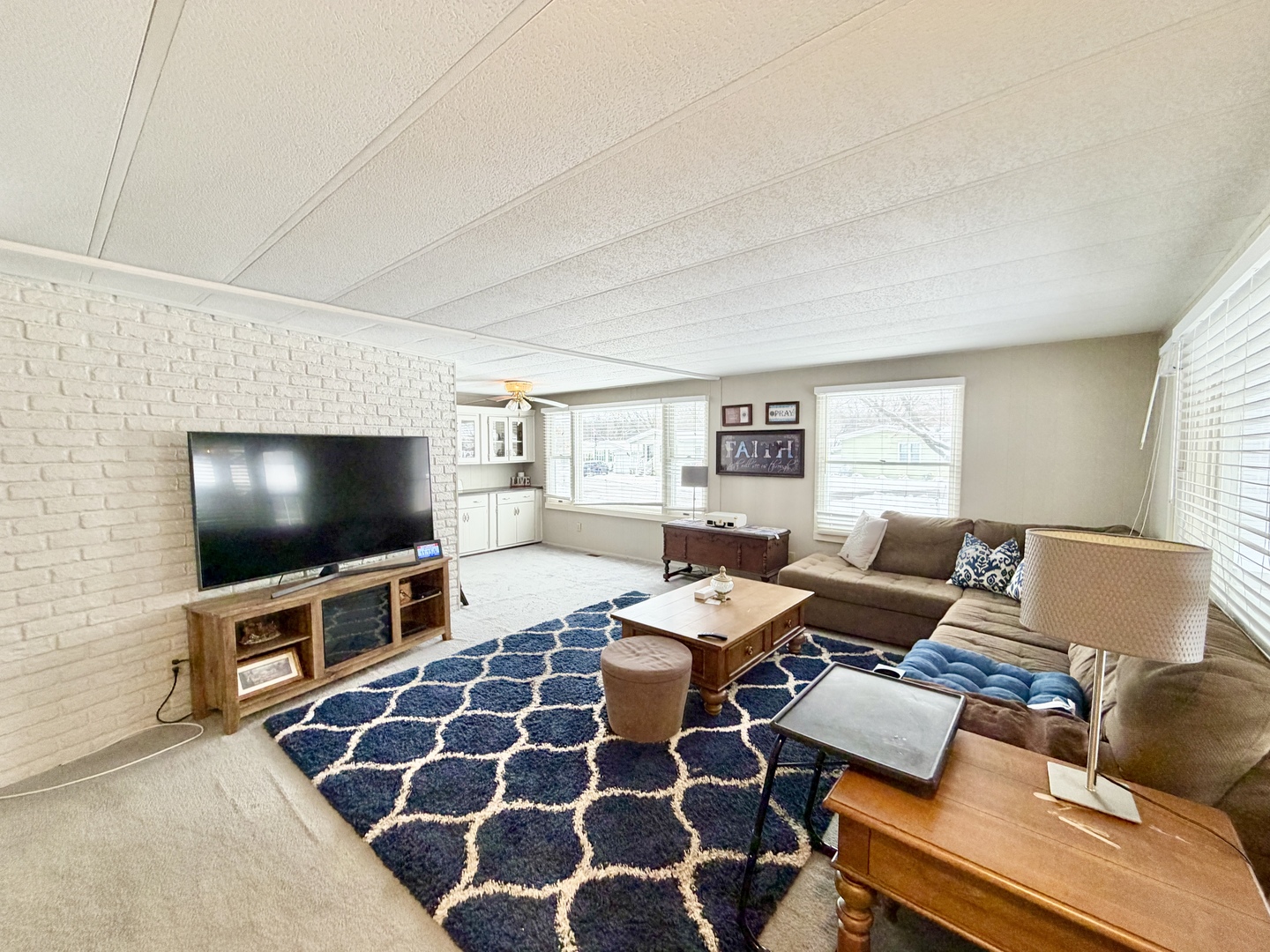 114 Melbrooke Road Elgin, IL 60123 - Photo 5 of 19 a living room with furniture and a flat screen tv