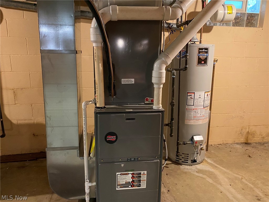 2232 Devonshire Road Northwest Canton, OH 44708 - Photo 23 of 31 Basement - Heater and Hot Water Tank