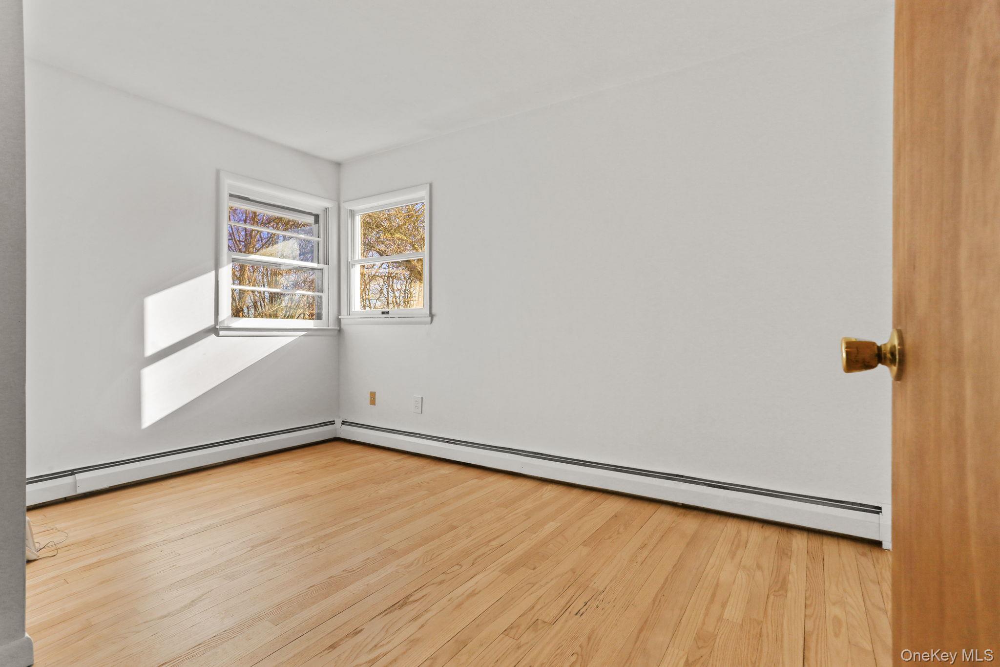 48 Friendly Road Mahopac, NY 10541 - Photo 11 of 24 wooden floor in an empty room with a window