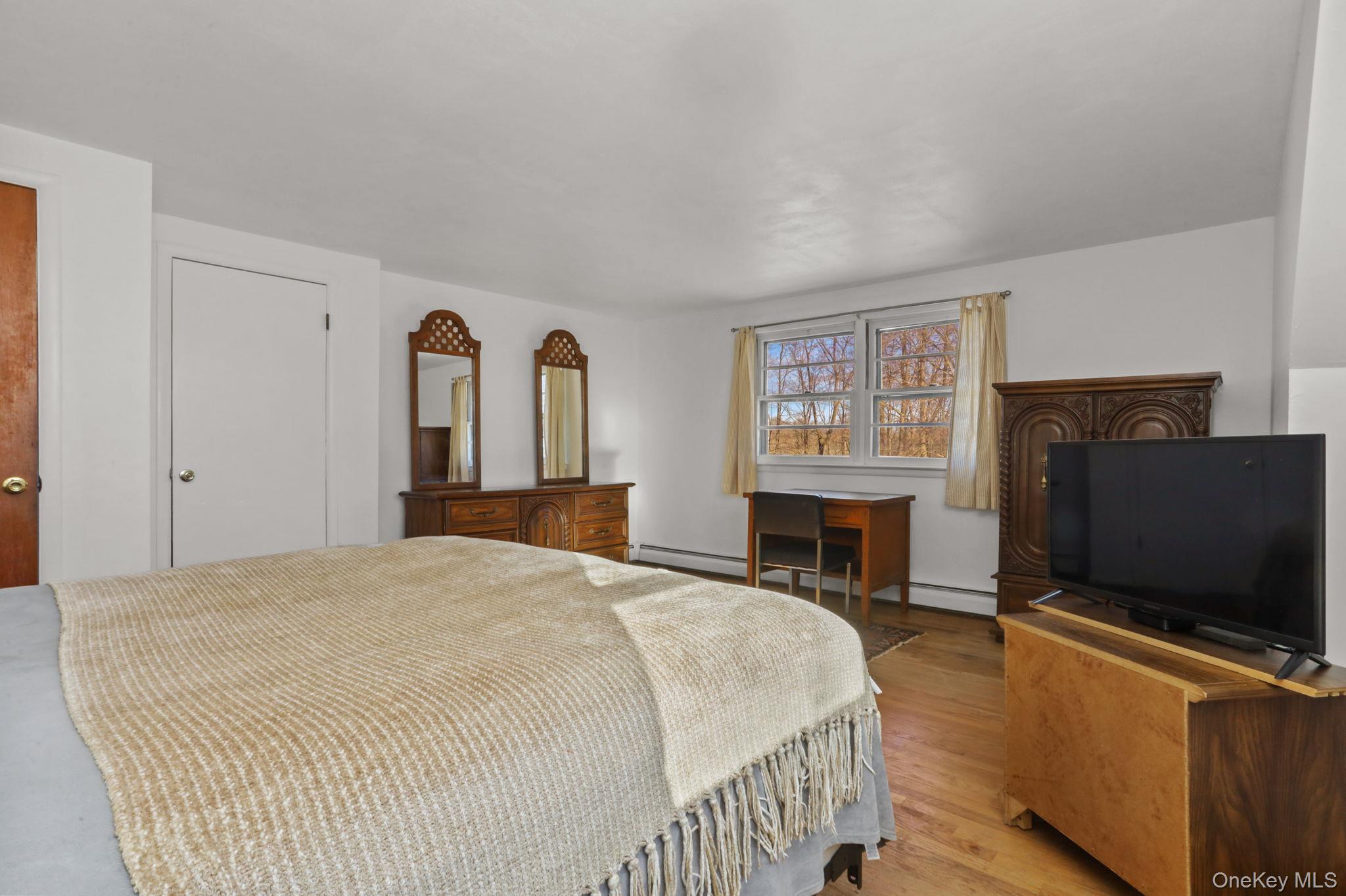 48 Friendly Road Mahopac, NY 10541 - Photo 13 of 24 a bedroom with a bed and a flat screen tv