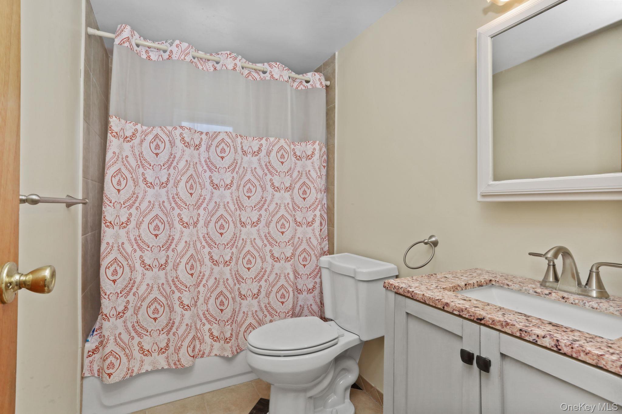 48 Friendly Road Mahopac, NY 10541 - Photo 16 of 24 a bathroom with a granite countertop toilet sink and mirror