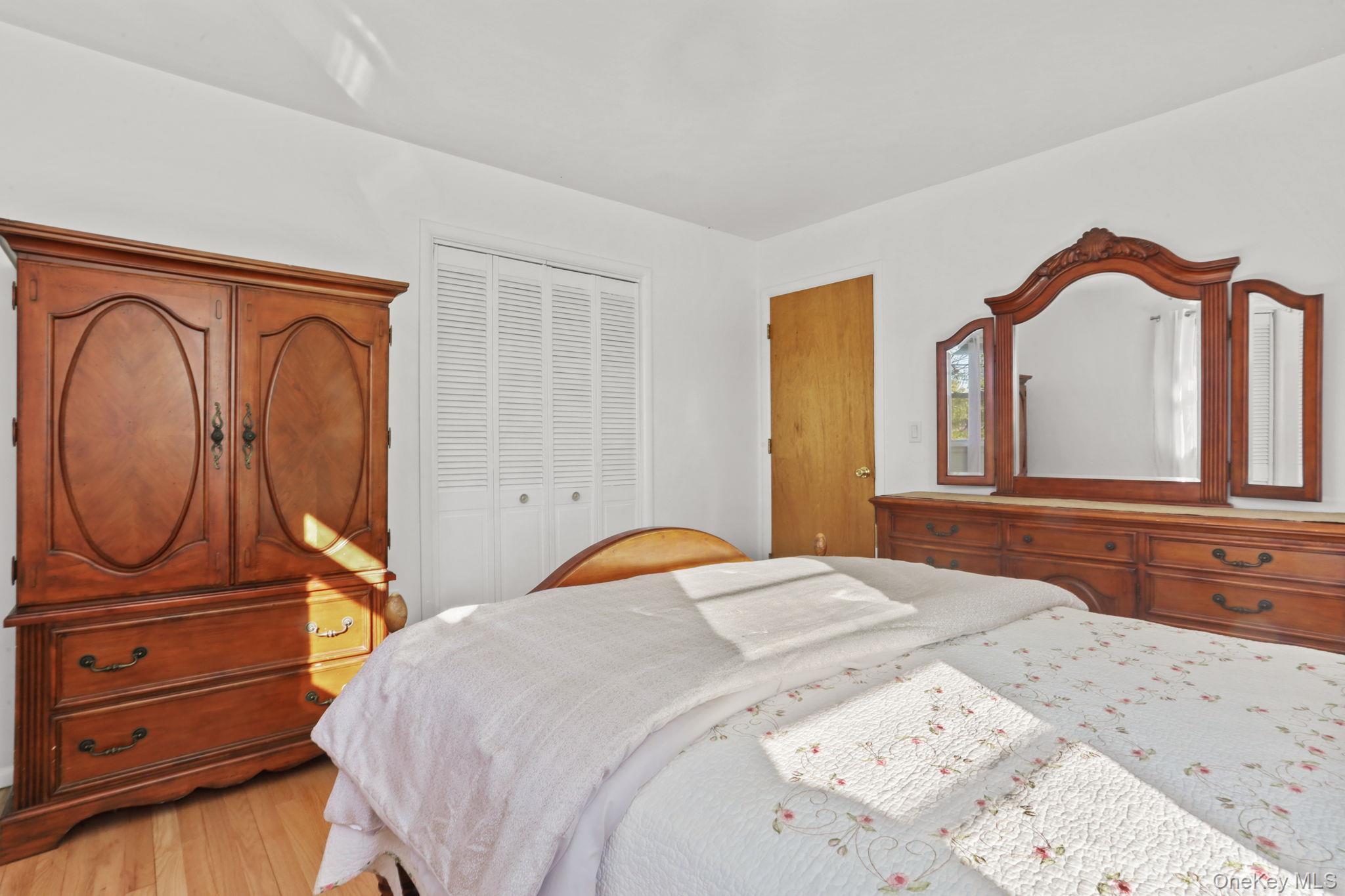 48 Friendly Road Mahopac, NY 10541 - Photo 9 of 24 a bedroom with a bed and a dresser