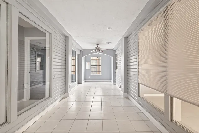 a view of a hallway with windows