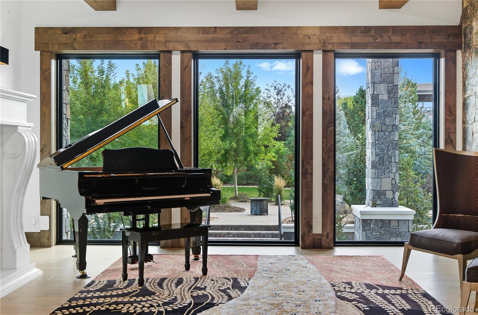 1470 White Hawk Ranch Drive Boulder, CO 80303 - Photo 16 of 50 a living room with furniture a lamp and a potted plant