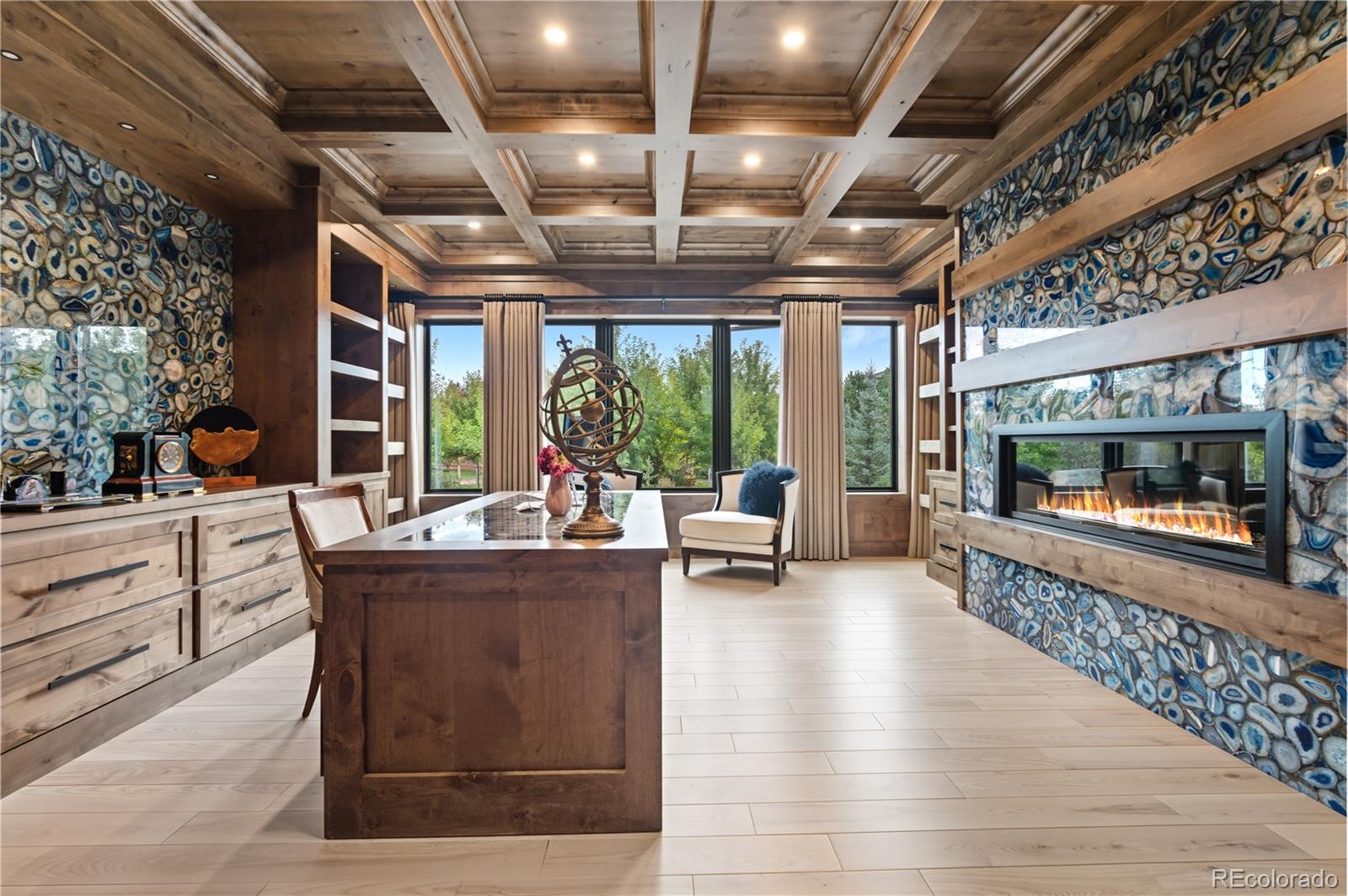 1470 White Hawk Ranch Drive Boulder, CO 80303 - Photo 22 of 50 a living room with patio furniture and a wooden floor