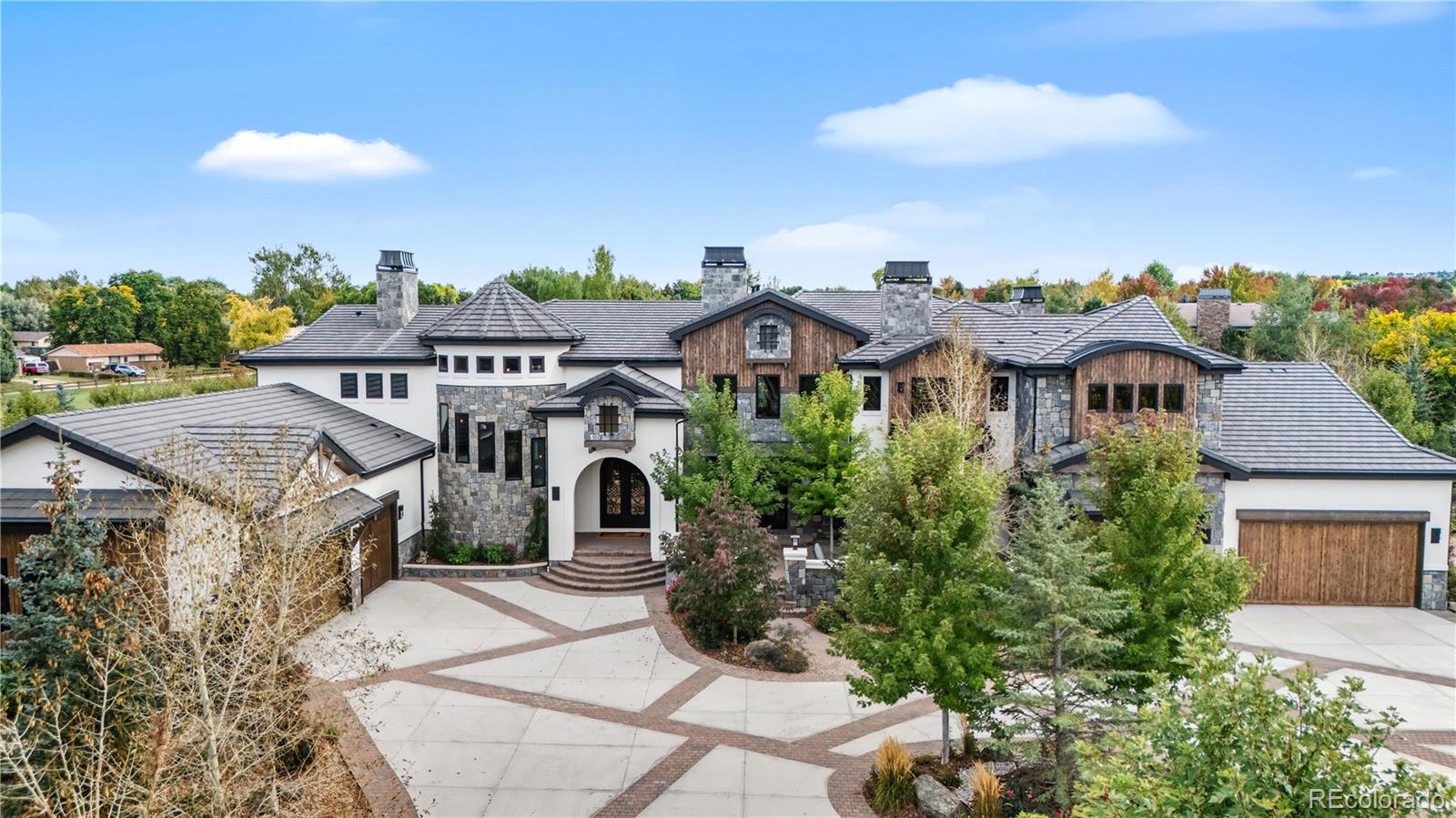 1470 White Hawk Ranch Drive Boulder, CO 80303 - Photo 3 of 50 a front view of a house with a yard and garage