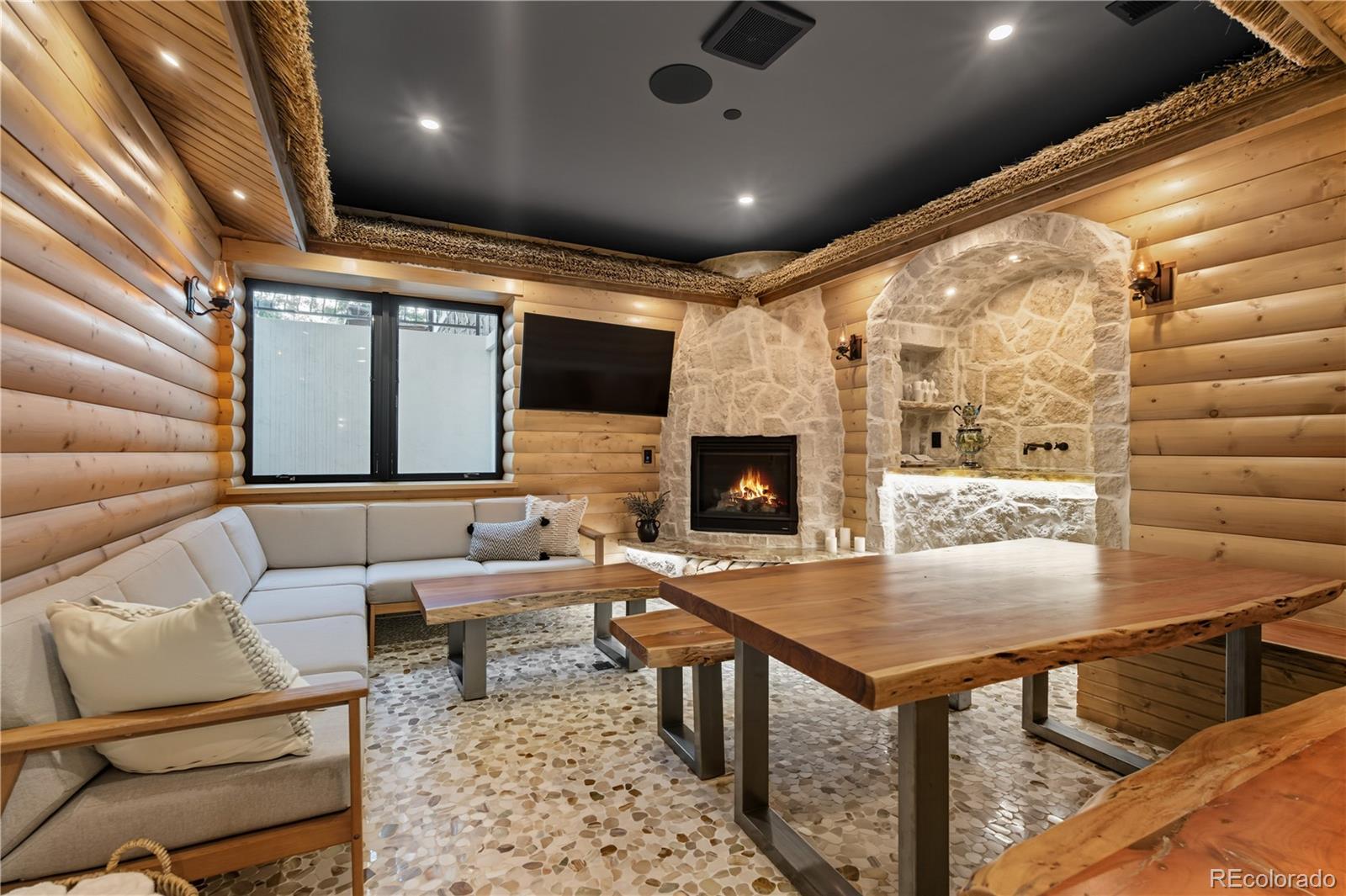 1470 White Hawk Ranch Drive Boulder, CO 80303 - Photo 44 of 50 a living room with furniture and a fireplace