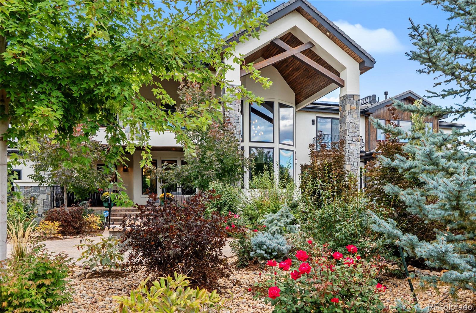 1470 White Hawk Ranch Drive Boulder, CO 80303 - Photo 5 of 50 a backyard of a house with lots of green space and garden view