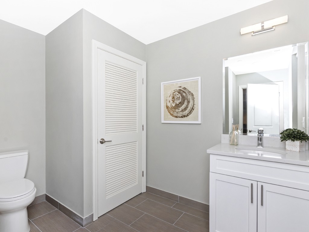 260 Gold Street, Unit 1 Boston, MA 02127 - Photo 13 of 16 a bathroom with a sink toilet and vanity