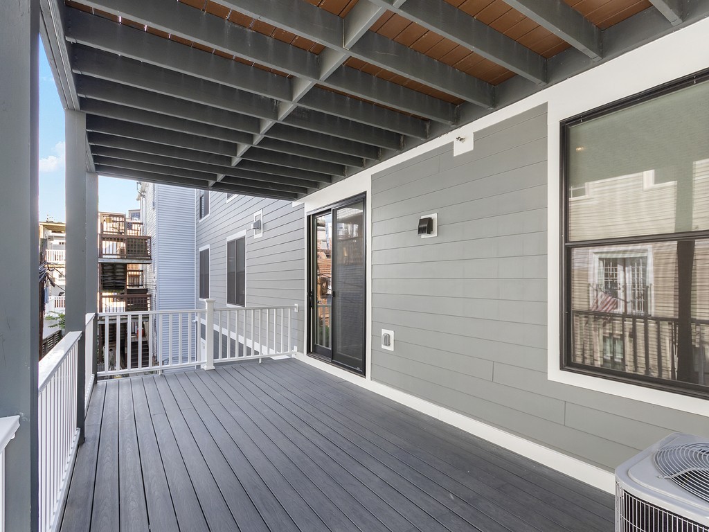 260 Gold Street, Unit 1 Boston, MA 02127 - Photo 14 of 16 a view of porch with wooden floor