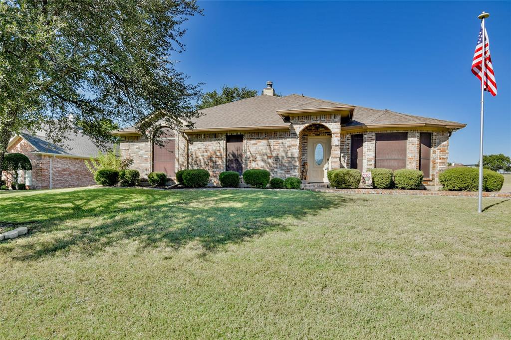 9100 Bellechase Road Granbury, TX 76049 - Photo 1 of 37 a front view of a house with garden