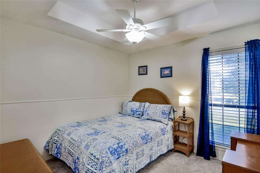 9100 Bellechase Road Granbury, TX 76049 - Photo 12 of 37 a bedroom with a bed and window