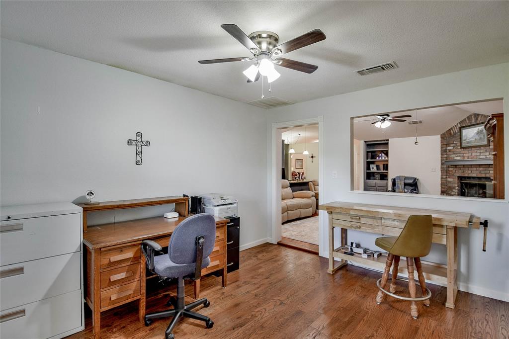 9100 Bellechase Road Granbury, TX 76049 - Photo 25 of 37 a view of a workspace with furniture and a workspace