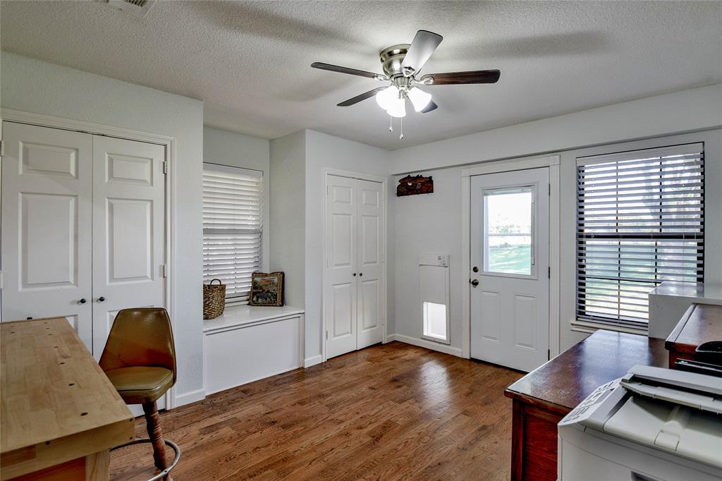 9100 Bellechase Road Granbury, TX 76049 - Photo 26 of 37 a living room with furniture and wooden floor