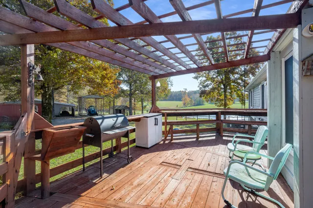 a sitting area with furniture on wooden floor