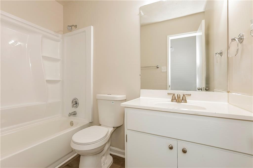 3352 Herrenhut Road Lithonia, GA 30038 - Photo 20 of 27 a bathroom with a sink toilet and bathtub